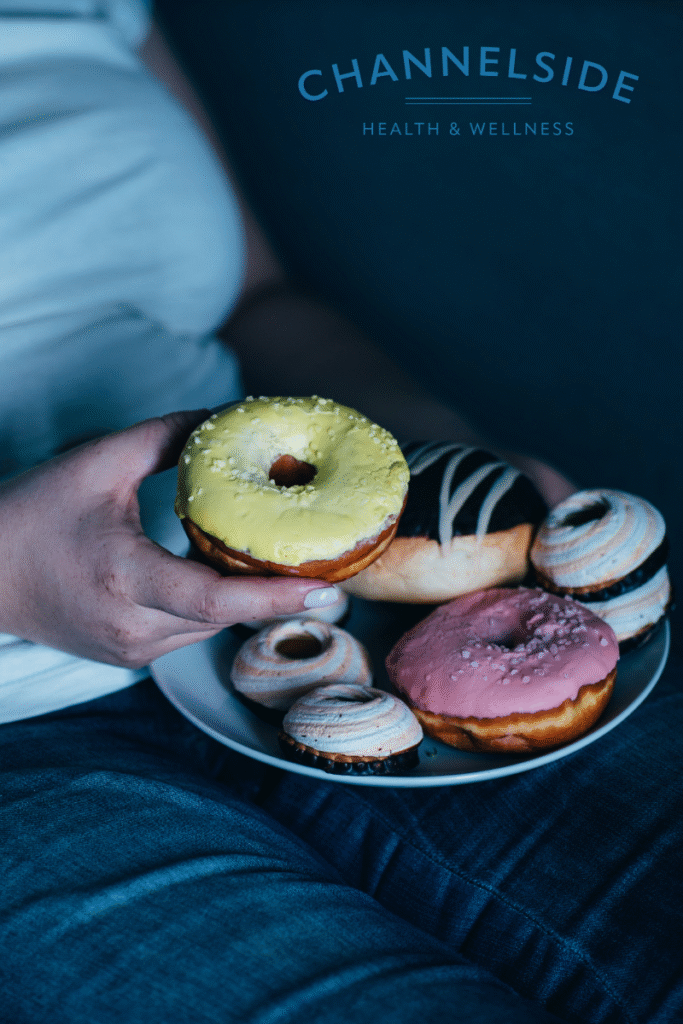 someone stress eating donuts.