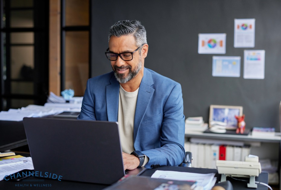 Improve testosterone, improve energy, reduce aging. -Happy man at a desk